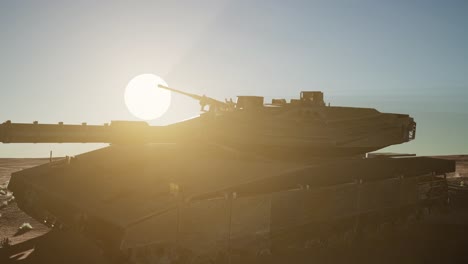 old rusty tank in the desert at sunset