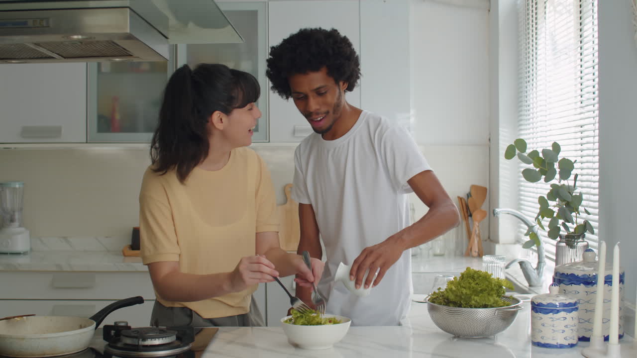 Couple Mixing Salad Ingredients for Breakfast at Home