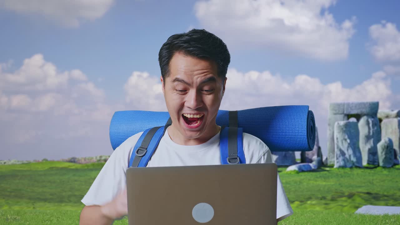 Excited Man Celebrating Success with Laptop