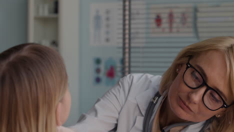doctor examining a child patient