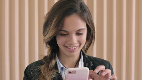 cute hispanic woman portrait of beautiful young woman enjoying texting browsing using smartphone technology