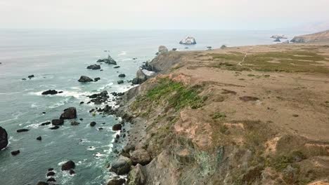 Drone-pan-over-ocean-cliff