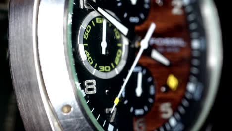 a macro shot of the second hand ticking on the wrist watch