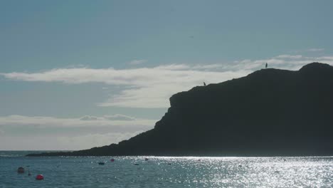 4k cinematic landscape shot of the beach of lulworth cove, dorset on a sunny day