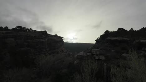 Sunrise-over-rodeno-red-sandstone-mountains-in-Albarracin,-Teruel,-Spain,-with-a-changing-cloudset