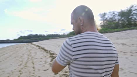 young couple having romantic walk on beach