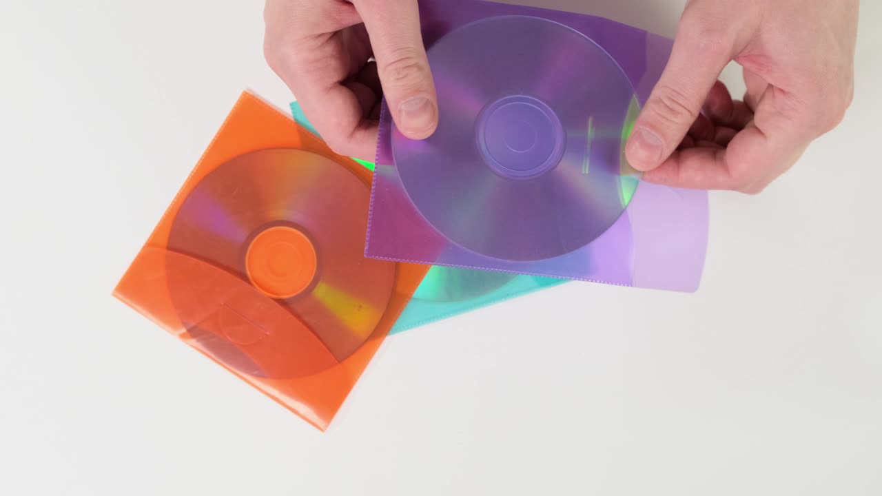Hand hold disk on white background.