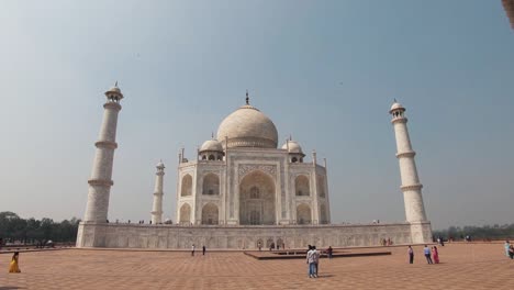 visitors at the taj mahal, white  marble mausoleum in agra, india.