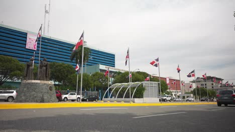 cars passing by roadway in santo domingo city.