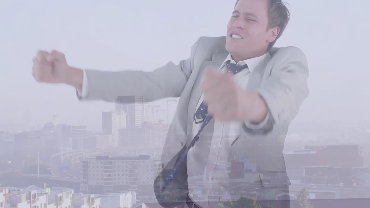 Celebrating success, businessman expressing excitement and joy over cityscape background