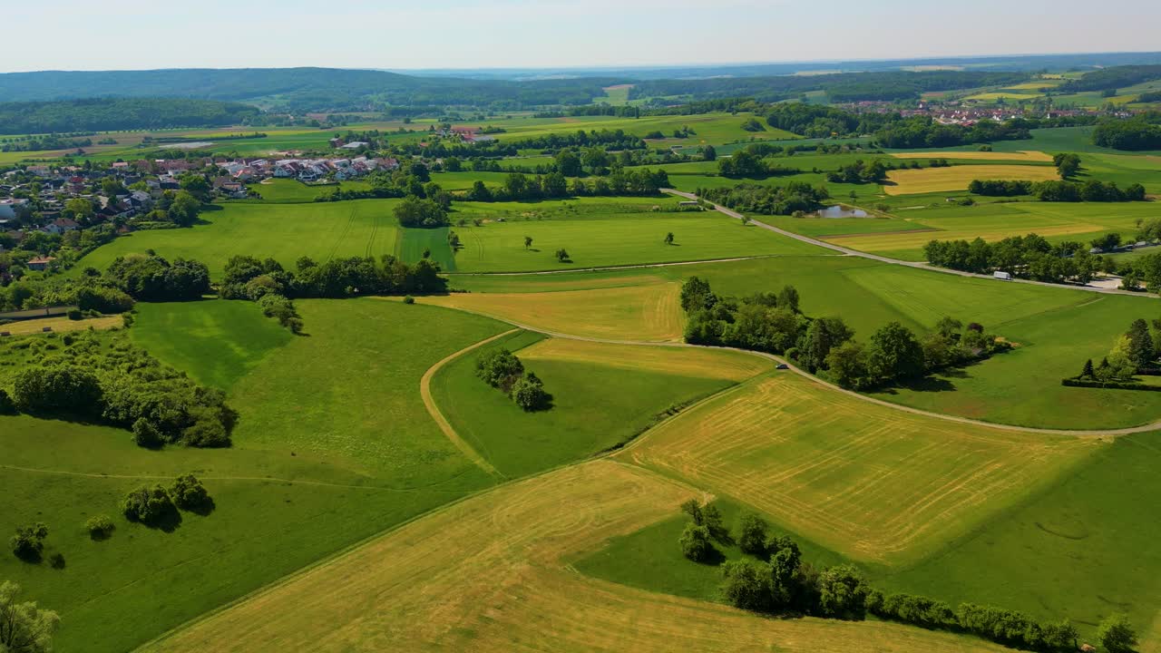 4K Aerial Drone Video of the Village and Farmland Below the Historic Bamberg Castle on the edge of Bamberg, Germany on a Beautiful Spring Day