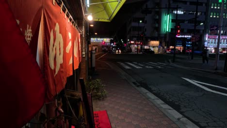 flag waving over urban night-time street scene