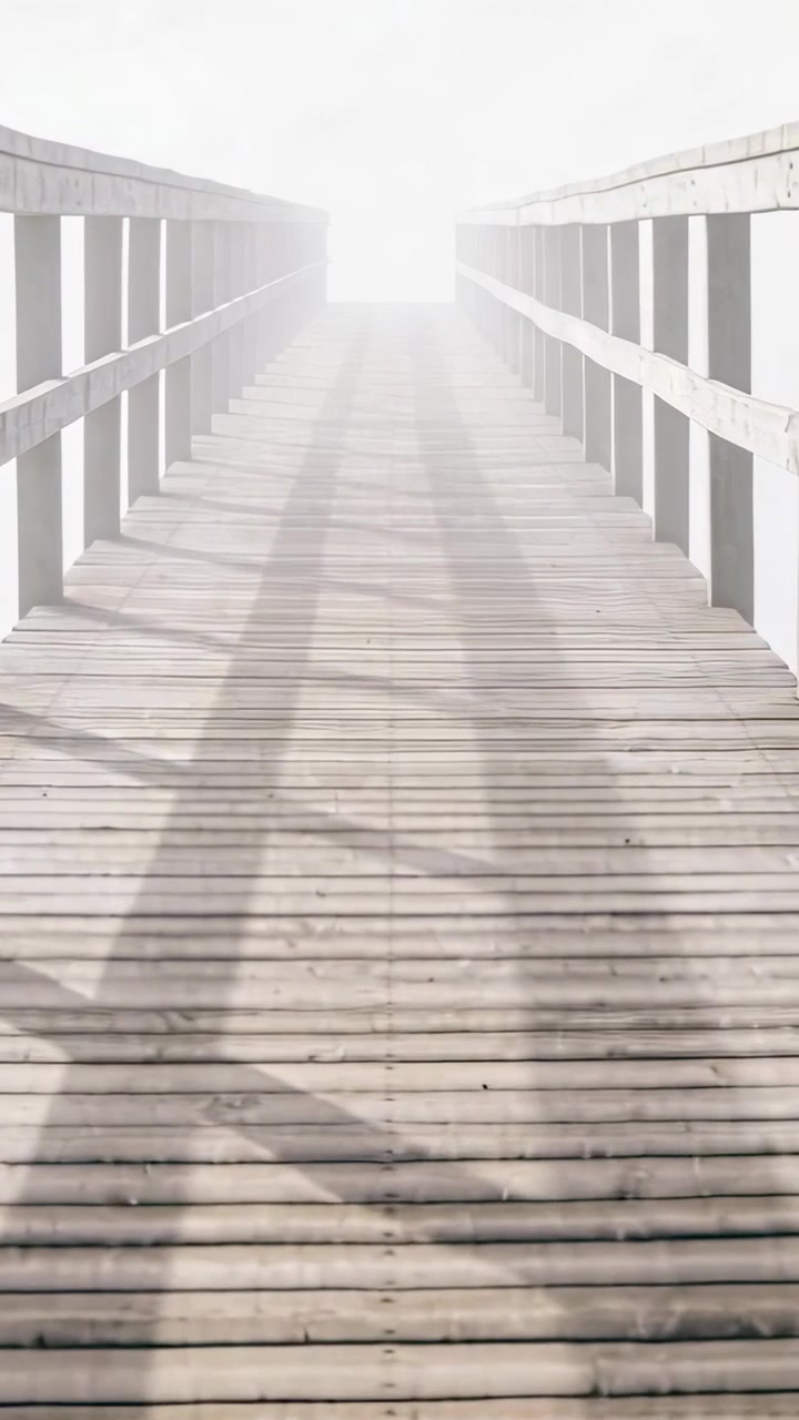 Centered wooden pier moving ahead, bright glare rising, causing camera zooming, shadows fading film