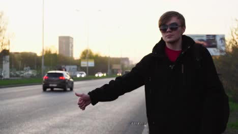 person waiting for a ride on the street