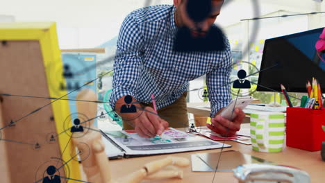 Network connections and data processing animation over man working at desk