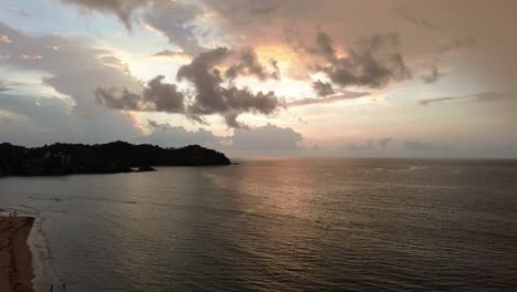 the warm color of this sea flies every one of my senses. the drone sees the golden hour this bay in sayulita, mexico that is a place for surfers and surfers makes life more magical.
