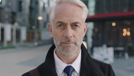 close up of corporate businessman portrait of serious professional man standing in city