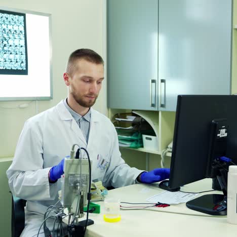 doctor talking to patient in office. male doctor in lab coat sitting at desk in clinic