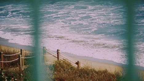 ocean surf crashes on a private beach