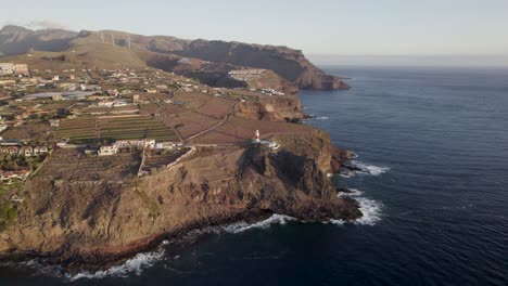 birds eye view of la gomera island and it's lighthouse. drone shot