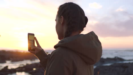 a young woman in pigtails using her smartphone to