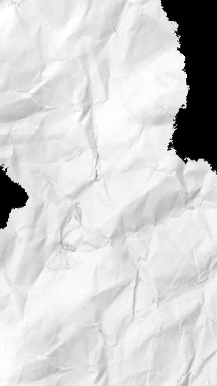 Skrynklig vit papperstextur som visas och försvinner på svart bakgrund