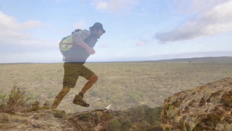 hiker leaping onto rocky outcrop under sky, displaying animated growth chart for outdoor marketing