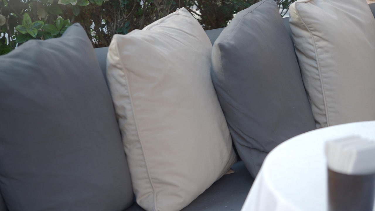 Stylish Outdoor Seating with Neutral Colored Cushions
