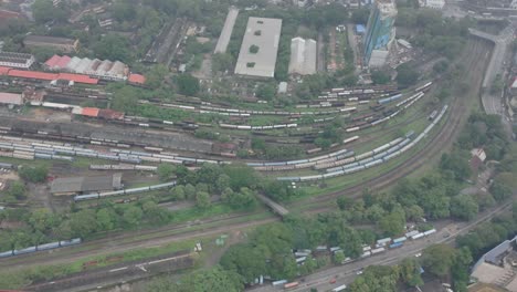 aerial view from the lotus tower in colombo, sri lanka showing a train station and a passing train below