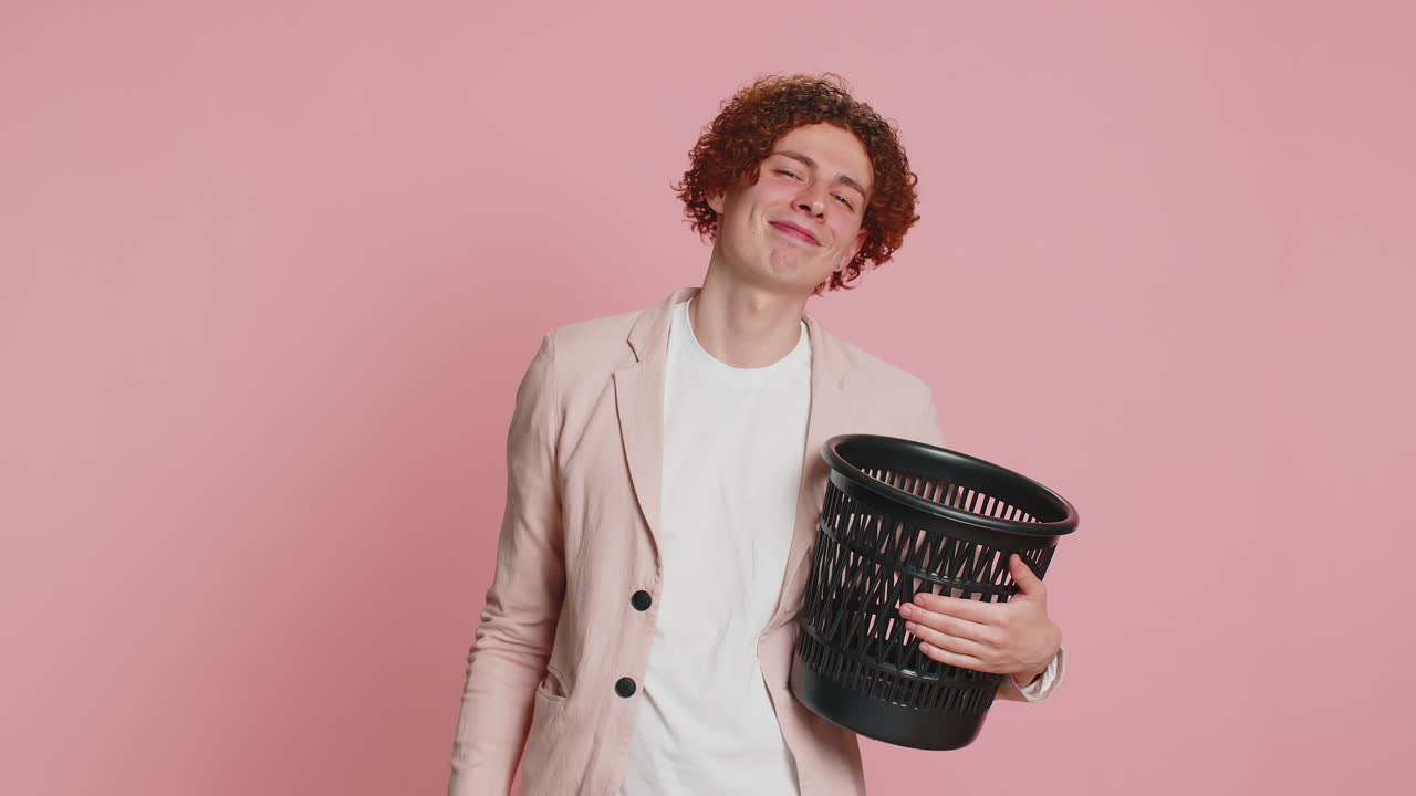 Man taking off, throwing out glasses into bin after medical vision laser treatment therapy surgery