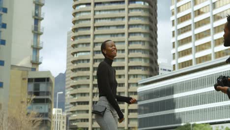 woman posing for photo shoot in city street 4k