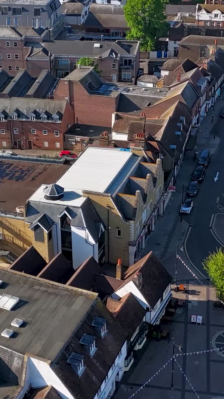 Portrait hyperlapse over Hoddesdon Town Centre, houses and rooftops to main road