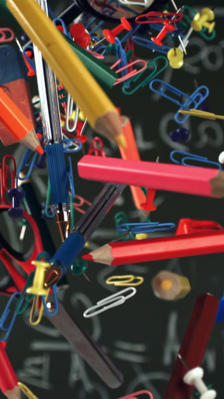 Colorful School Supplies Floating Against a Chalkboard with Math Equations