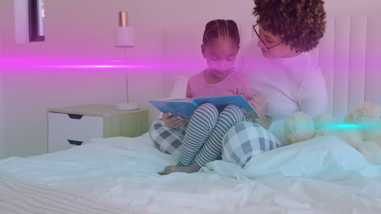 Child opening blue book, mom leaning and guiding for learning while pink cyan streak crossing faces