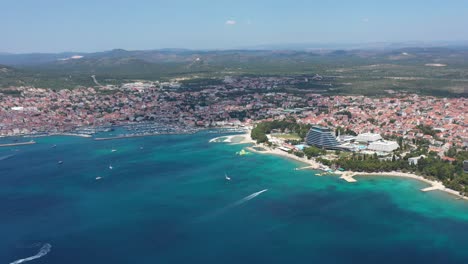 Panoramic-View-On-The-Town-Of-Vodice-On-Adriatic-Sea,-Marina-And-Turquoise-Coastline-In-Croatia---aerial-drone-shot
