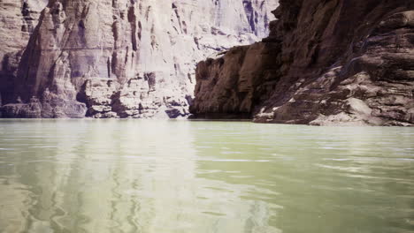 serene river landscape with rocky cliffs and calm water reflections
