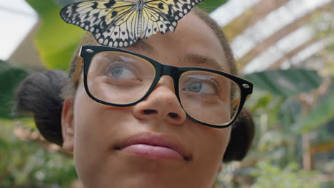 happy-girl-smiling-with-butterfly-on-face-fluttering-wings-having-fun-with-wildlife-in-nature-conservation-zoo-teenage-biology-nerd-4k