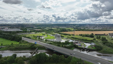 4k close up aerial push in towards the the kelpies, the largest quine sculptures in the world