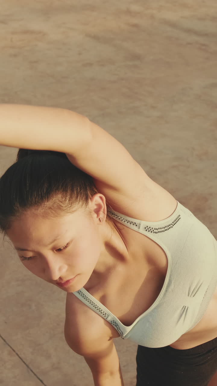 Woman stretching in sportswear outdoors