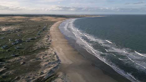 drone shot of cabo polonio peninsula with strong waves and wild landscape, uruguay