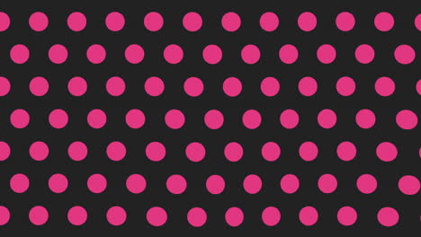 playful pink and black polka dot pattern on a bold black background