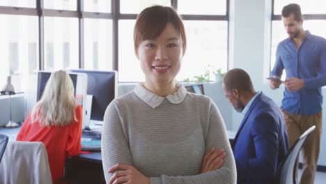 businesswoman looking at camera in modern office