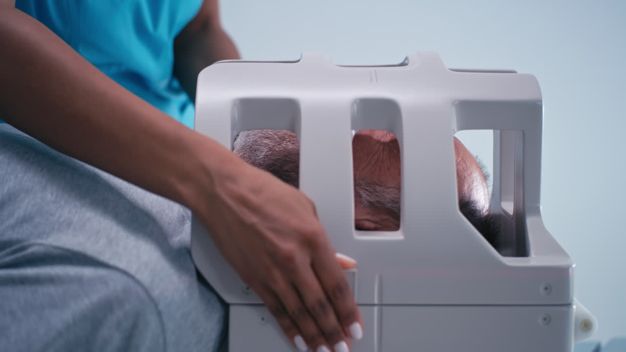 Patient undergoing head scan procedure