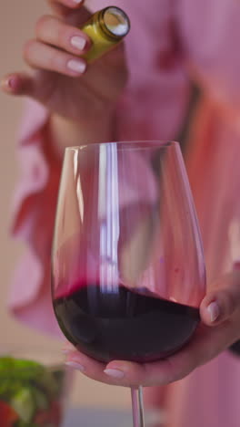 faithless wife adds venom white powder into annoying husband wineglass and stirs red wine to kill and get freedom at home slow motion closeup