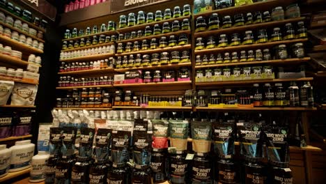 sport nutrition store interior with large choice of nutritional supplements.