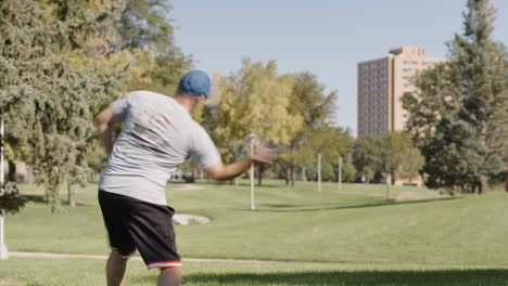 disc golf tee shot on discgolf course in