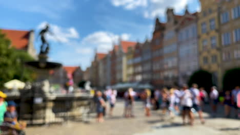 Tourists-at-Neptune's-Fountain-in-Gdansk-historic-city-center
