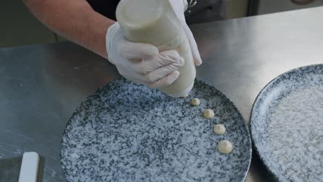 a professional chef is preparing a hamburger in his kitchen - 07