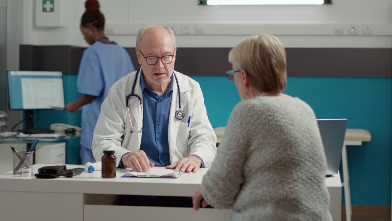 Senior physician doing checkup consultation with retired sick patient