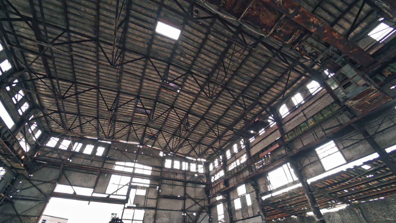 Ruined roof of an old abandoned factory. Industrial building for demolition.